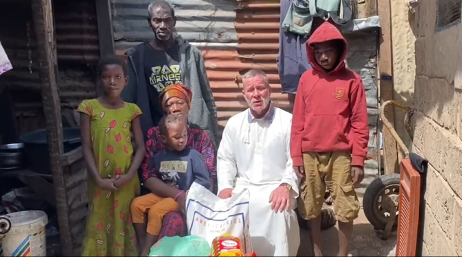 Friends of Gambia volunteer delivering food parcels to a family in The Gambia