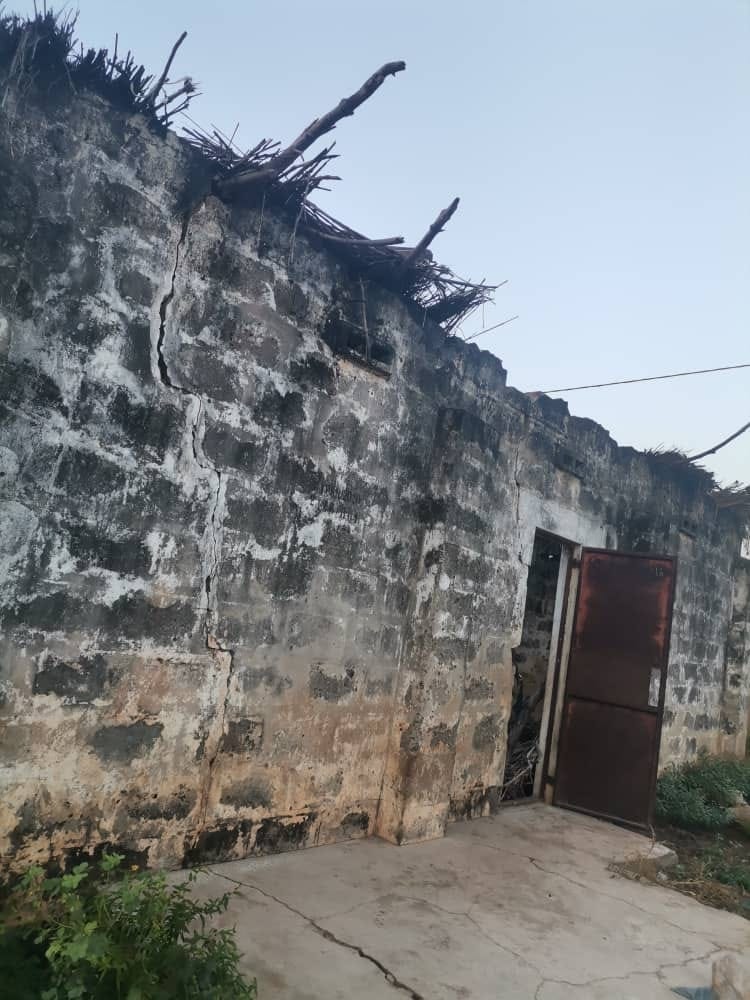 Blackhall Madrasa exterior before restoration — cracked walls and damaged roof
